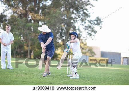 Boys playing cricket View Large Photo Image Stock Photo - Boys playing cricket. Fotosearch