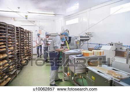 Bread packing production line in small bakery View Large Photo Image Stock Photo - Bread packing production line in small bakery. Fotosearch