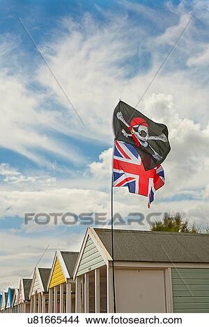 British flag and pirate flag on beach hut in Southwold, Suffolk, UK View Large Photo Image Picture - British flag and pirate flag on beach hut in Southwold, Suffolk, UK. Fotosearch