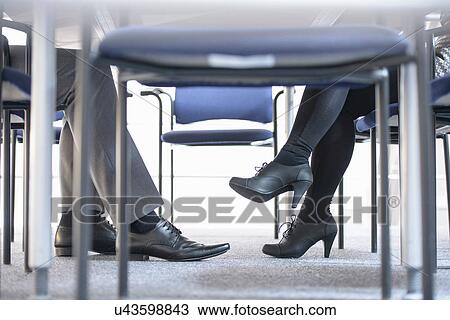 Businessman and woman in meeting, low section View Large Photo Image Stock Image - Businessman and woman in meeting, low section. Fotosearch
