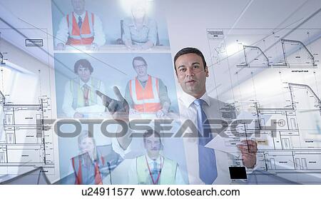 Stock Photo - Businessman in video conference, view through screen. Fotosearch