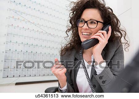 Businesswoman on telephone call, smiling View Large Photo Image Stock Image - Businesswoman on telephone call, smiling. Fotosearch