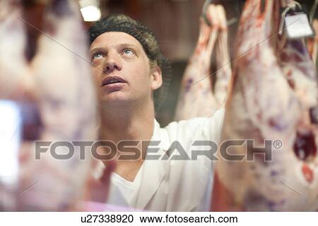 Butcher inspecting meat View Large Photo Image Stock Image - Butcher inspecting meat. Fotosearch
