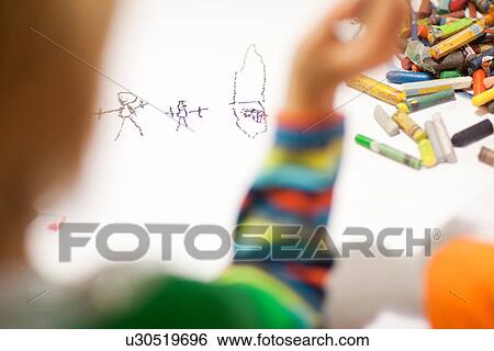 Stock Photograph - Child drawing with crayons. Fotosearch