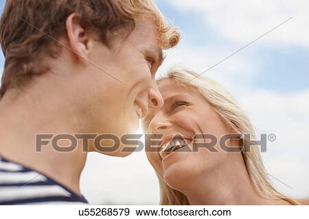 Close up of young couple face to face View Large Photo Image Stock Photo - Close up of young couple face to face. Fotosearch