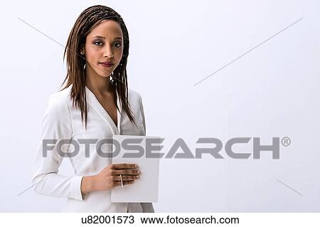 Stock Image - Close up portrait of young female with digital tablet. Fotosearch