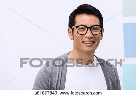 Close up portrait of young male designer View Large Photo Image Stock Photo - Close up portrait of young male designer. Fotosearch