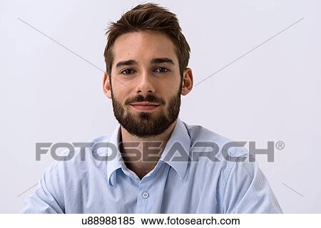 Close up portrait of young man in blue shirt View Large Photo Image Stock Photography - Close up portrait of young man in blue shirt. Fotosearch