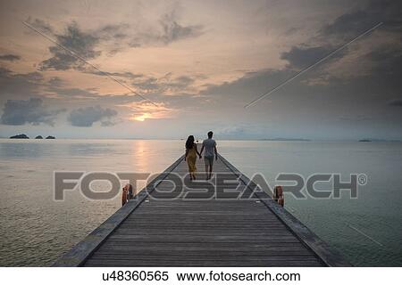 Couple on pier, Taling Ngam Beach, Ko Samui, Thailand View Large Photo Image Stock Photography - Couple on pier, Taling Ngam Beach, Ko Samui, Thailand. Fotosearch