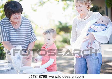 Family setting dinner table outdoors View Large Photo Image Stock Photography - Family setting dinner table outdoors. Fotosearch