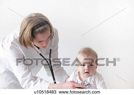 Female doctor examining baby's chest View Large Photo Image Stock Image - Female doctor examining baby's chest. Fotosearch