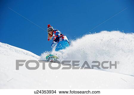Female snowboarder in action View Large Photo Image Picture - Female snowboarder in action. Fotosearch