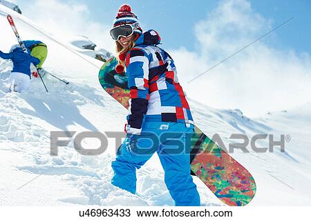 Female snowboarder in snow View Large Photo Image Stock Image - Female snowboarder in snow. Fotosearch