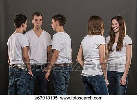 Five teenagers standing chatting View Large Photo Image Stock Photography - Five teenagers standing chatting. Fotosearch