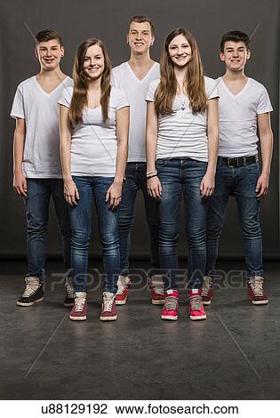 Five teenagers standing in a group View Large Photo Image Stock Image - Five teenagers standing in a group. Fotosearch