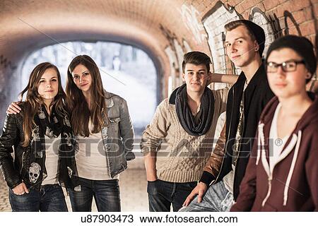 Five teenagers standing in underpass View Large Photo Image Stock Image - Five teenagers standing in underpass. Fotosearch