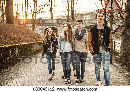 Five teenagers walking together View Large Photo Image Stock Image - Five teenagers walking together. Fotosearch