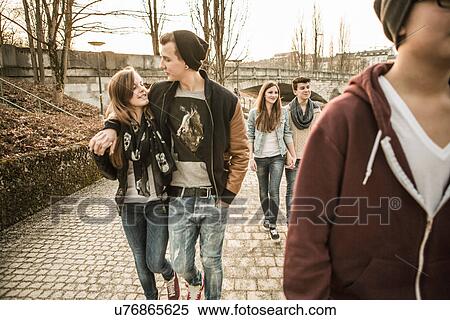 Stock Photography - Five teenagers walking together. Fotosearch