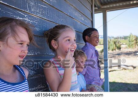 Four children outside clapboard cabin View Large Photo Image Stock Image - Four children outside clapboard cabin. Fotosearch