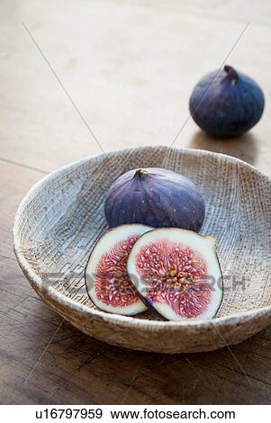 Stock Photo - Fresh figs in wooden bowl. Fotosearch