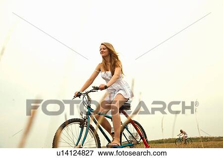 Girl riding bike View Large Photo Image Stock Photo - Girl riding bike. Fotosearch