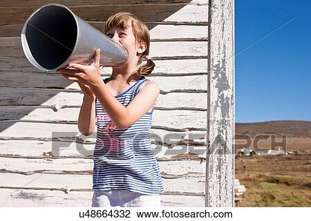 Stock Image - Girl with megaphone. Fotosearch