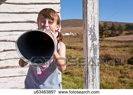 Girl with megaphone View Large Photo Image Stock Photo - Girl with megaphone. Fotosearch