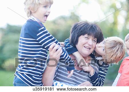 Grandmother with twin grandsons View Large Photo Image Stock Image - Grandmother with twin grandsons. Fotosearch