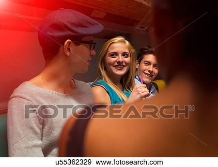 Group of friends sitting smiling View Large Photo Image Stock Photo - Group of friends sitting smiling. Fotosearch
