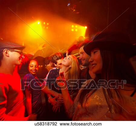 Group of people at party, man kissing woman's neck View Large Photo Image Stock Image - Group of people at party, man kissing woman's neck. Fotosearch