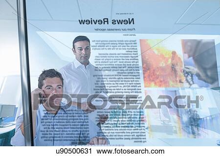 Journalist and blogger reading news, view through screen View Large Photo Image Stock Image - Journalist and blogger reading news, view through screen. Fotosearch