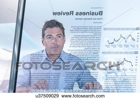 Stock Photo - Journalist and blogger reading news, view through screen. Fotosearch