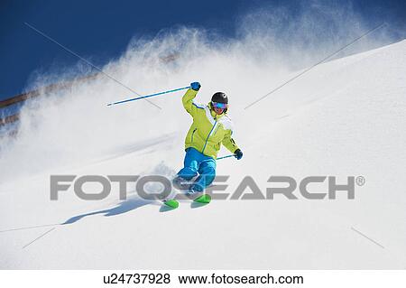 Stock Photo - Male skier in action. Fotosearch