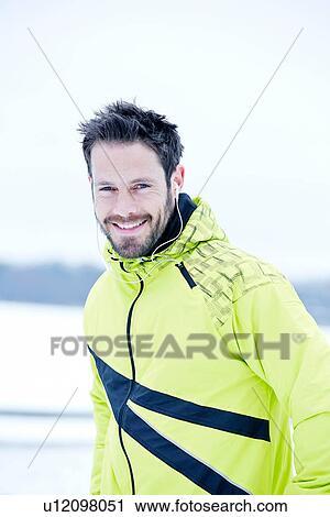 Man in yellow tracksuit smiling View Large Photo Image Stock Image - Man in yellow tracksuit smiling. Fotosearch