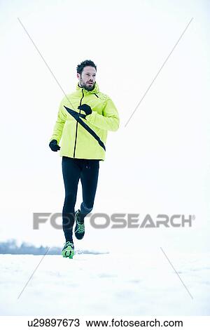 Stock Image - Man snow running. Fotosearch