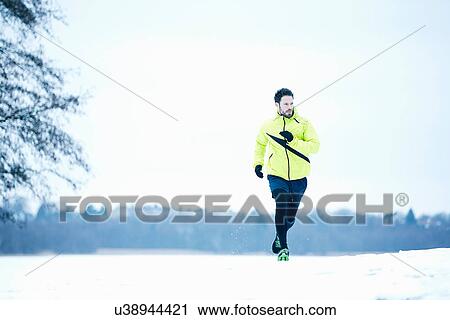 Stock Image - Man snow running. Fotosearch