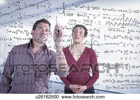 Mathematicians writing complex scientific equations on screen View Large Photo Image Stock Image - Mathematicians writing complex scientific equations on screen. Fotosearch