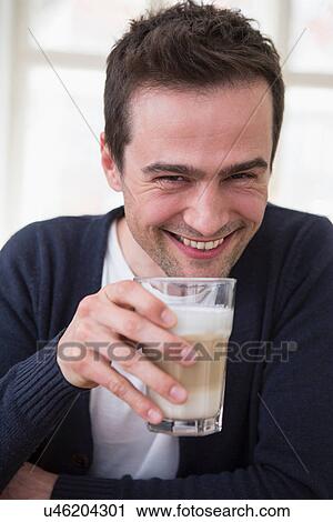 Mature man drinking a smoothie View Large Photo Image Stock Image - Mature man drinking a smoothie. Fotosearch