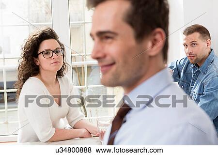 Mature man smiling, mid adults in background View Large Photo Image Stock Photo - Mature man smiling, mid adults in background. Fotosearch