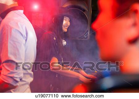 Mid adult woman disc jockey View Large Photo Image Stock Image - Mid adult woman disc jockey. Fotosearch