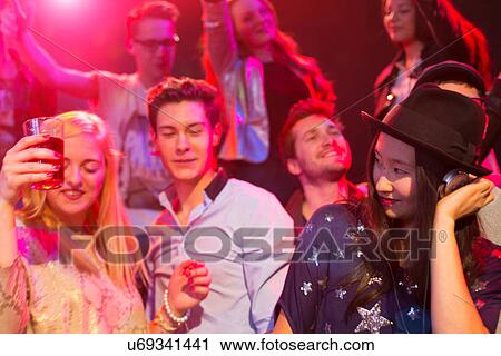 Mid adult woman DJ at party View Large Photo Image Stock Image - Mid adult woman DJ at party. Fotosearch
