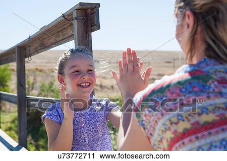 Mother and daughter playing pat a cake View Large Photo Image Stock Image - Mother and daughter playing pat a cake. Fotosearch