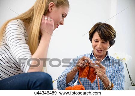 Mother teaching daughter kitting View Large Photo Image Stock Photo - Mother teaching daughter kitting. Fotosearch