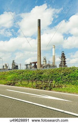 Stock Image - Motorway and oil refinery in Rotterdam Harbour, Holland. Fotosearch