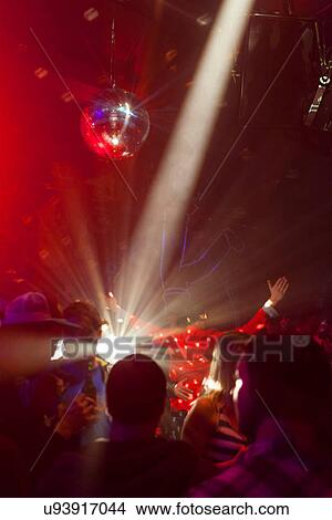 Nightclub scene with people dancing, disco ball, lighting equipment View Large Photo Image Picture - Nightclub scene with people dancing, disco ball, lighting equipment. Fotosearch