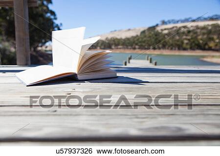 Open book on pier View Large Photo Image Stock Photograph - Open book on pier. Fotosearch