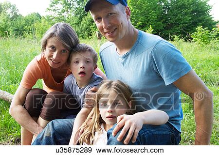 Outdoor portrait of family with two children View Large Photo Image Stock Photo - Outdoor portrait of family with two children. Fotosearch
