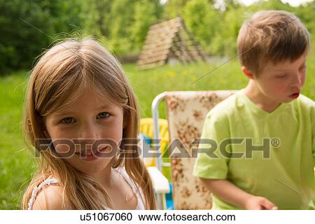 Outdoor portrait of sister and brother View Large Photo Image Stock Image - Outdoor portrait of sister and brother. Fotosearch