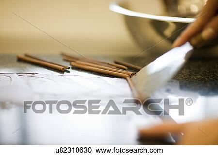 Person making chocolate rolls View Large Photo Image Stock Image - Person making chocolate rolls. Fotosearch