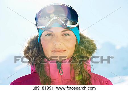 Stock Image - Portrait of a young female skier. Fotosearch